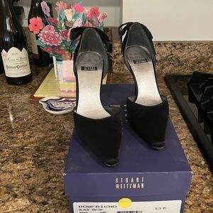 Black silk heels with satin bow in back.